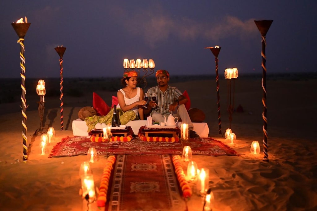 Dinner on the dunes under warm desert evening light